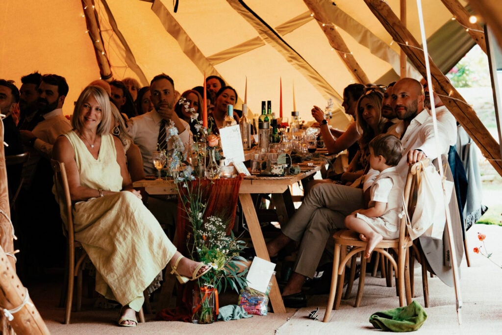 Wedding breakfast with guests outside The Sheriffs at White Heron Estate wedding venue Herefordshire